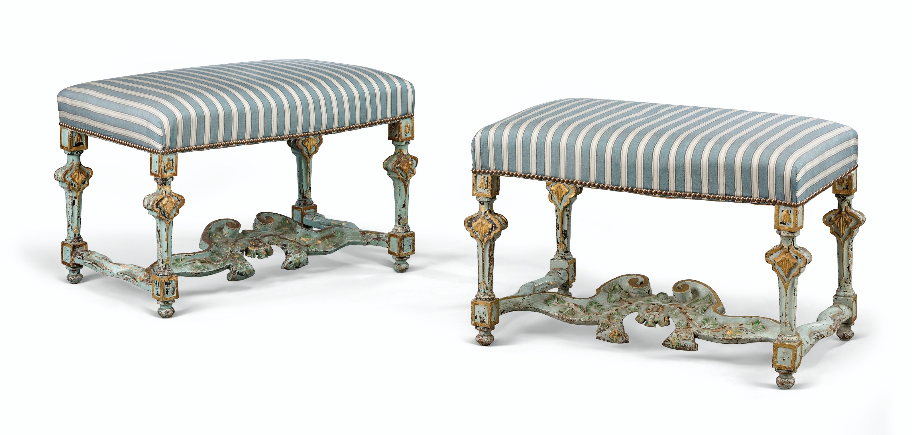 A PAIR OF NORTH ITALIAN PARCEL-GILT, BLUE AND POLYCHROME-PAINTED STOOLS