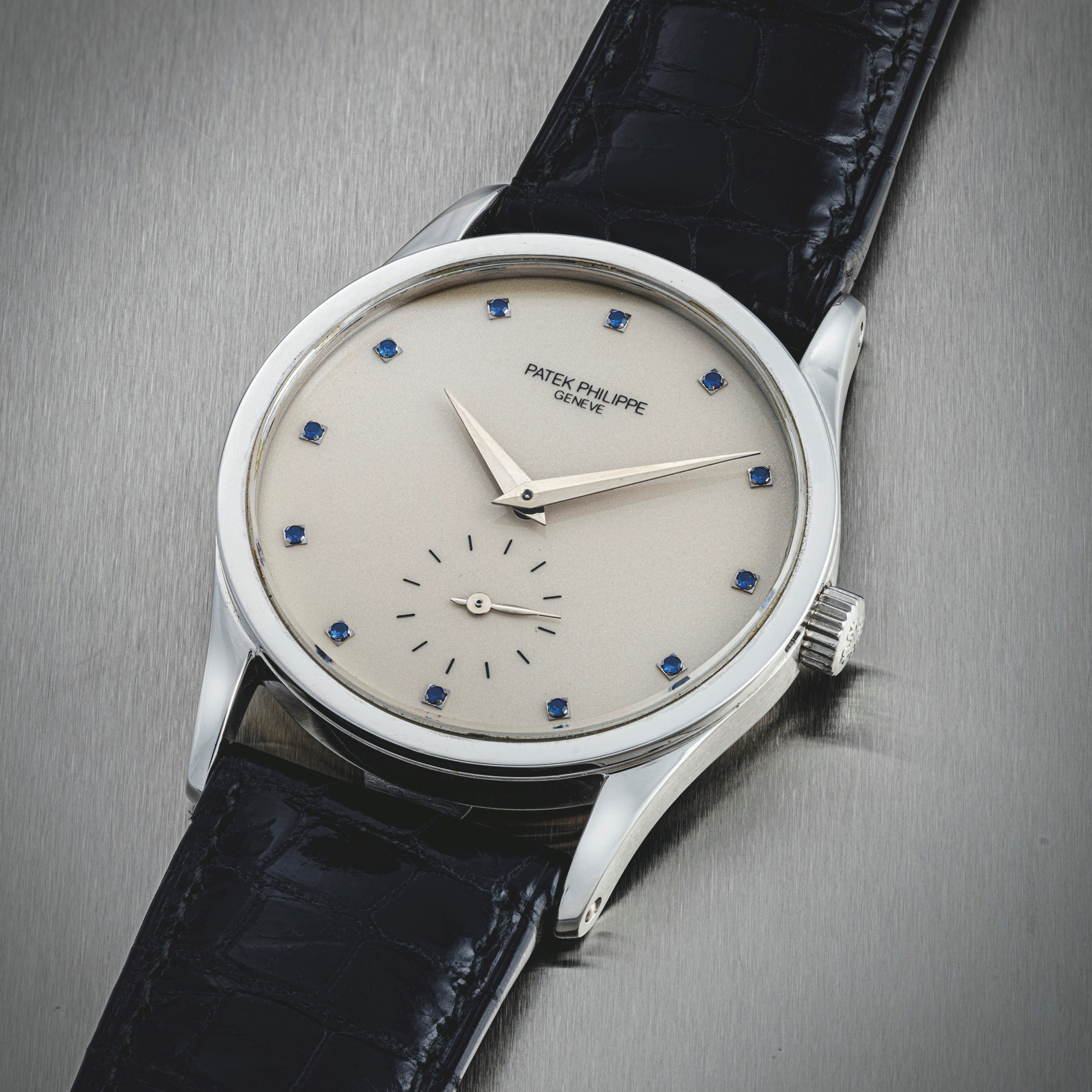 PATEK PHILIPPE. A FINE PLATINUM AND SAPPHIRE-SET WRISTWATCH