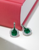 AN EXQUISITE FORMS EMERALD AND DIAMOND EARRINGS