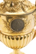 A GEORGE III ORMOLU, SILVER AND PASTE-SET VASE TIMEPIECE TABLE CLOCK