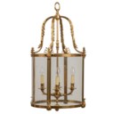 A GILT-LACQUERD BRASS HALL LANTERN
