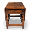 A GEORGE II OAK GATE-LEG DINING-TABLE