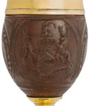 A PAIR OF GEORGE III SILVER-GILT MOUNTED COCONUT CUPS