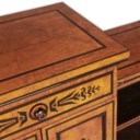 A REGENCY POLLARD OAK, EBONY AND EBONISED BREAKFRONT SIDE CABINET