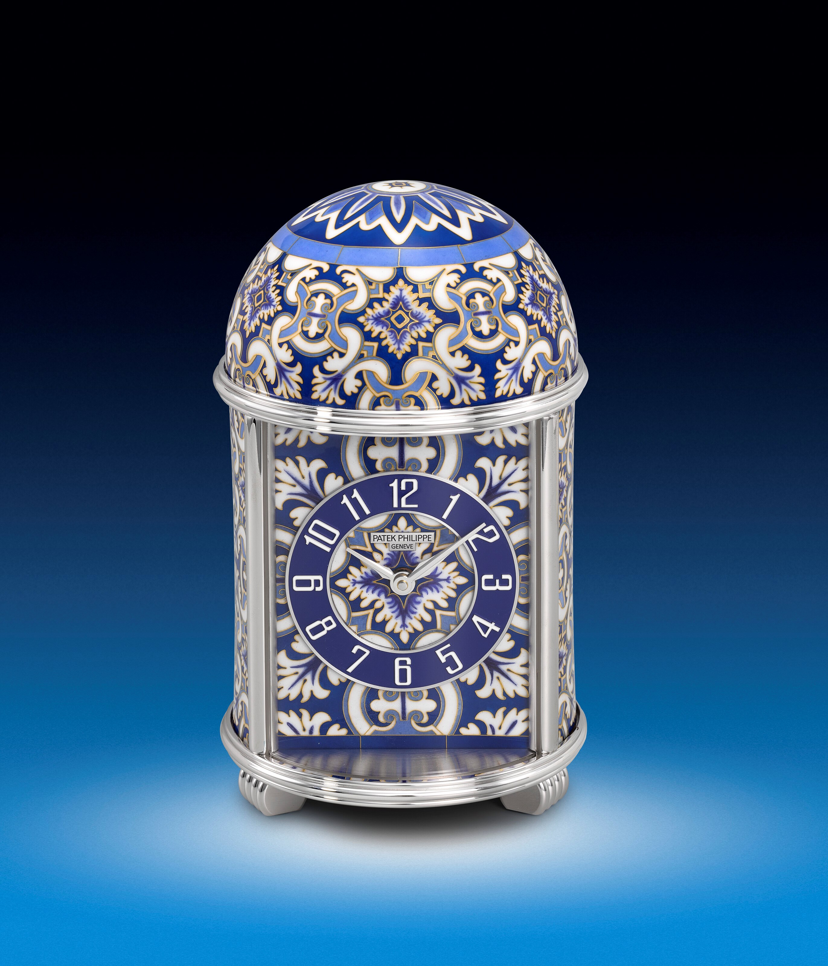 PATEK PHILIPPE. AN EXCEPTIONAL AND UNIQUE SILVERED BRASS DOME TABLE CLOCK WITH CLOISONNÉ ENAMEL IN THE STYLE OF TRADITIONAL IBERIAN AZULEJOS CERAMIC